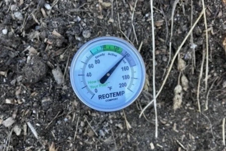 compost thermometer in compost pile